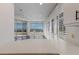 White kitchen with water views and plantation shutters at 3070 Grand Bay Blvd # 625, Longboat Key, FL 34228