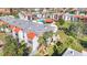 Aerial view of residential buildings with a swimming pool surrounded by palm trees at 3273 Beneva Rd # 101, Sarasota, FL 34232