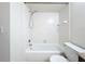 Bathroom showcasing a tiled shower-tub combination, toilet, and granite vanity at 3273 Beneva Rd # 101, Sarasota, FL 34232