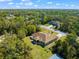 Aerial view of single-Gathering home with backyard and basketball hoop at 3273 Wentworth St, North Port, FL 34288