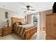 Bedroom with wood furniture and large window at 3273 Wentworth St, North Port, FL 34288