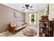 Bedroom with ceiling fan, wood furniture, and window at 3273 Wentworth St, North Port, FL 34288