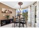 Kitchen dining area with table and chairs near window at 3273 Wentworth St, North Port, FL 34288