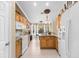 Bright kitchen with granite countertops and wood cabinets at 3273 Wentworth St, North Port, FL 34288