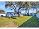 Spacious backyard with mature trees and a well maintained lawn at 3446 Monica Pkwy, Sarasota, FL 34235