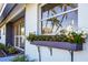 Close-up of exterior flower box brimming with white blossoms, adding to the home's curb appeal at 3446 Monica Pkwy, Sarasota, FL 34235