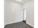 Bright hallway with neutral walls and black and white patterned flooring at 3446 Monica Pkwy, Sarasota, FL 34235