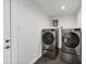 Washer and dryer units on risers in dedicated laundry area at 3446 Monica Pkwy, Sarasota, FL 34235