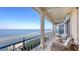 The covered balcony has ample seating with stunning waterfront views, perfect for relaxing at 3628 Fair Oaks Pl, Longboat Key, FL 34228