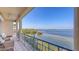 Enjoy outdoor living on this upper-level balcony with panoramic water views, perfect for relaxation at 3628 Fair Oaks Pl, Longboat Key, FL 34228