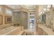 Elegant bathroom featuring a separate shower and soaking tub with stylish finishes at 3628 Fair Oaks Pl, Longboat Key, FL 34228