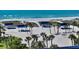 Beautiful beach scene featuring white sand, clear blue water, and shaded picnic areas at 3628 Fair Oaks Pl, Longboat Key, FL 34228