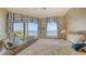 Bright bedroom with water view and balcony access at 3628 Fair Oaks Pl, Longboat Key, FL 34228