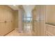 Hallway features custom cabinetry and access to several rooms in the home at 3628 Fair Oaks Pl, Longboat Key, FL 34228