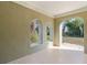 Back patio with arched windows and view of backyard at 3711 20Th E St, Bradenton, FL 34208