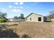 House backyard view, grassy area and partial fence view at 3711 20Th E St, Bradenton, FL 34208