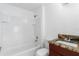 Bathroom with granite countertop and tiled shower/tub combo at 3711 20Th E St, Bradenton, FL 34208