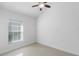 Well-lit bedroom featuring tile floors and a ceiling fan at 3711 20Th E St, Bradenton, FL 34208