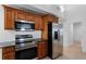 Stainless steel appliances and wood cabinets in this kitchen at 3711 20Th E St, Bradenton, FL 34208