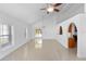 Spacious living room with tile floors, high ceilings, and a ceiling fan at 3711 20Th E St, Bradenton, FL 34208