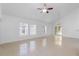 Open concept living room with tile floors and ceiling fan at 3711 20Th E St, Bradenton, FL 34208