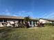 Lawn and garden view of rear exterior with windows at 3739 Collins St # 701, Sarasota, FL 34232