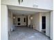 View of tiled carport featuring entry doors into the home at 3739 Collins St # 701, Sarasota, FL 34232