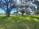 Spacious community grounds featuring mature trees and well-maintained landscaping around the homes at 3739 Collins St # 701, Sarasota, FL 34232