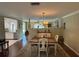 Dining room with wood flooring and view to living room at 3739 Collins St # 701, Sarasota, FL 34232