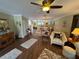 Spacious living room with wood flooring and ceiling fan and views to other rooms at 3739 Collins St # 701, Sarasota, FL 34232