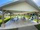 Community pavilion featuring covered seating and tables, ideal for gatherings and events at 3739 Collins St # 701, Sarasota, FL 34232