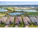 Aerial view of houses next to a golf course with ponds and beautiful greenery around at 3860 Santa Caterina Blvd, Bradenton, FL 34211