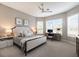 Bedroom with large windows, white shutters, desk, and neutral décor at 3860 Santa Caterina Blvd, Bradenton, FL 34211