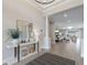 Open concept foyer showing modern decor with light wood floors and white pillars at 3860 Santa Caterina Blvd, Bradenton, FL 34211