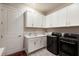 This laundry room features modern appliances, ample cabinet space, and a convenient sink at 3860 Santa Caterina Blvd, Bradenton, FL 34211