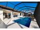 Enclosed pool area features a clear blue pool, jacuzzi, and an outdoor lounging area perfect for relaxation and entertainment at 3860 Santa Caterina Blvd, Bradenton, FL 34211