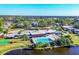 Community overview featuring a pool, buildings, and a picturesque lake at 3990 Overlook Bnd # 19, Sarasota, FL 34232