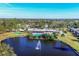 Community overview with lake, fountain, pool, and surrounding buildings at 3990 Overlook Bnd # 19, Sarasota, FL 34232