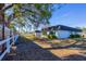 White building with brown roof, green landscaping, and a wooden fence at 3990 Overlook Bnd # 19, Sarasota, FL 34232