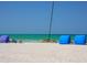 Beachfront view with calm ocean, beach chairs, and hobie cat at 421 Cleveland Dr, Sarasota, FL 34236