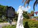 Historic statue of a Personal with informational plaque at 421 Cleveland Dr, Sarasota, FL 34236