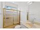 Bathroom with gold-framed shower, sink with vanity, toilet, and a mirror at 4244 Reflections Pkwy, Sarasota, FL 34233