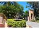 Ornamental fountain and iron gate at community entrance add to the community's appeal at 4244 Reflections Pkwy, Sarasota, FL 34233