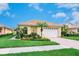 Single-story home showing landscaped lawn, brick driveway, and neutral color scheme at 4244 Reflections Pkwy, Sarasota, FL 34233