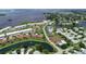 An aerial view shows the desirable waterfront community with canals, ponds and easy access to the Bay at 4722 Independence Dr, Bradenton, FL 34210