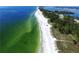 Aerial view of beach and coastal waters, showcasing its pristine, sandy shoreline at 4722 Independence Dr, Bradenton, FL 34210