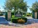 Palma Sola Botanical Park entrance with lush landscaping and brick-paved walkway at 4722 Independence Dr, Bradenton, FL 34210