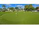 A manicured putting green offers residents the opportunity to practice their short game without leaving the community at 4722 Independence Dr, Bradenton, FL 34210