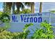 Mt. Vernon on Sarasota Bay community name on a brick wall surrounded by lush landscaping at 4722 Independence Dr, Bradenton, FL 34210