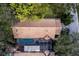 An aerial view of a home with a screened pool and lush green surroundings at 4768 Tivoli Ave, Sarasota, FL 34235